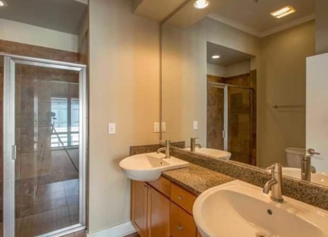 129 Walnut St Unit 322, Chattanooga, TN 37403 - full bath featuring double vanity, a stall shower, toilet, and recessed lighting