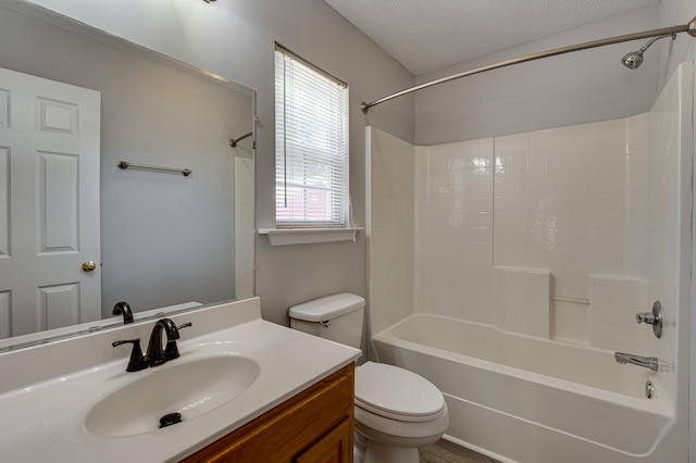 full bathroom with toilet, a textured ceiling, vanity, and  shower combination
