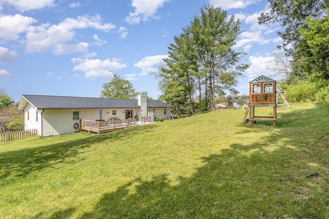 view of yard featuring fence and a wooden deck