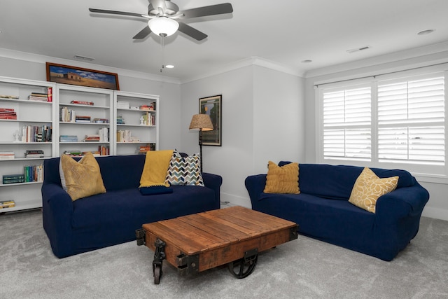 living area featuring carpet floors, a ceiling fan, crown molding, baseboards, and recessed lighting