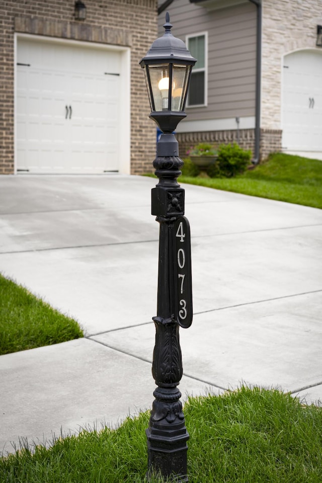 exterior view of concrete driveway and brick siding