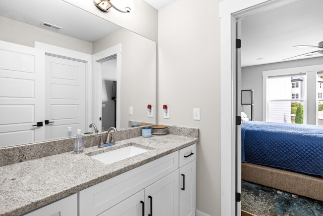 9876 Trestle Cir, Ooltewah, TN 37363 - ensuite bathroom featuring baseboards, visible vents, ceiling fan, vanity, and connected bathroom