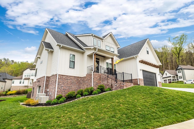 9876 Trestle Cir, Ooltewah, TN 37363 - view of front of property with a front lawn, driveway, board and batten siding, and cooling unit