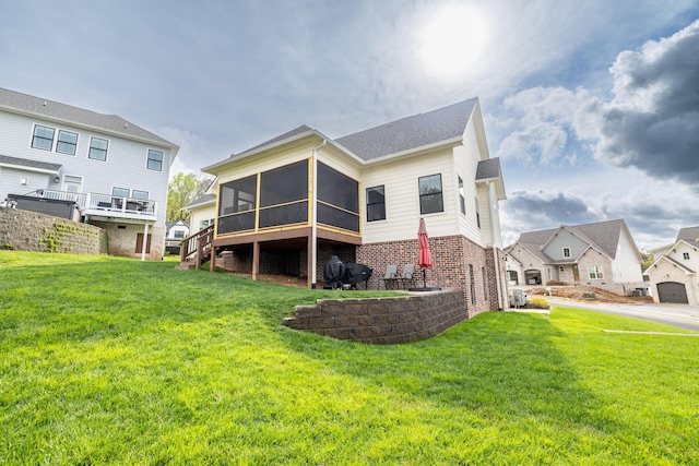9876 Trestle Cir, Ooltewah, TN 37363 - rear view of house featuring brick siding, a sunroom, a yard, and a residential view