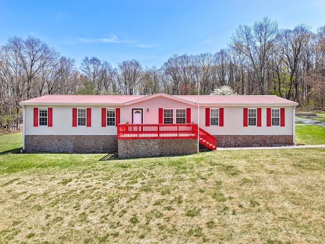 325 Pocket Rd, Whitwell, TN 37397 - manufactured / mobile home featuring a wooden deck, crawl space, a front yard, and metal roof