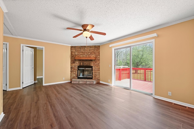 325 Pocket Rd, Whitwell, TN 37397 - unfurnished living room featuring a textured ceiling, dark wood-type flooring, ceiling fan, and crown molding