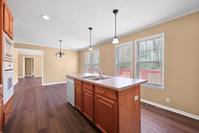 325 Pocket Rd, Whitwell, TN 37397 - kitchen with a sink, a textured ceiling, white appliances, light countertops, and dark wood finished floors