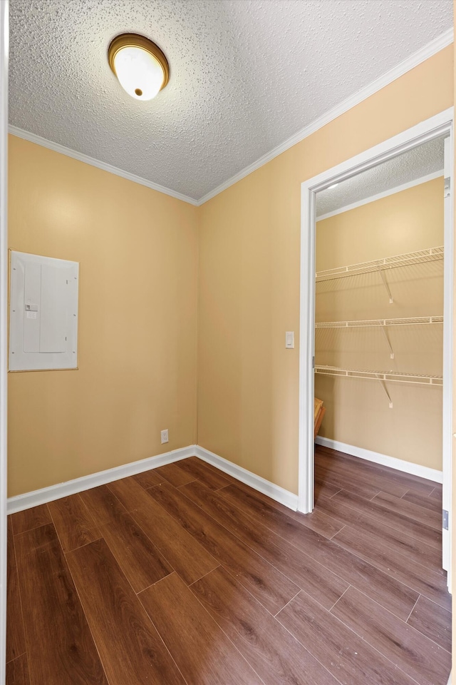 325 Pocket Rd, Whitwell, TN 37397 - empty room with a textured ceiling, wood finished floors, electric panel, and baseboards