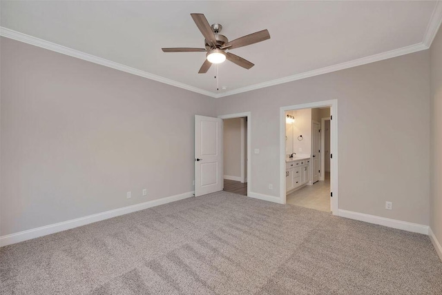 unfurnished bedroom with light carpet, baseboards, and ornamental molding