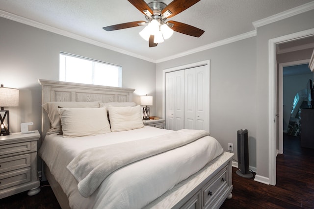 bedroom featuring ornamental molding, a closet, a ceiling fan, and dark wood-type flooring