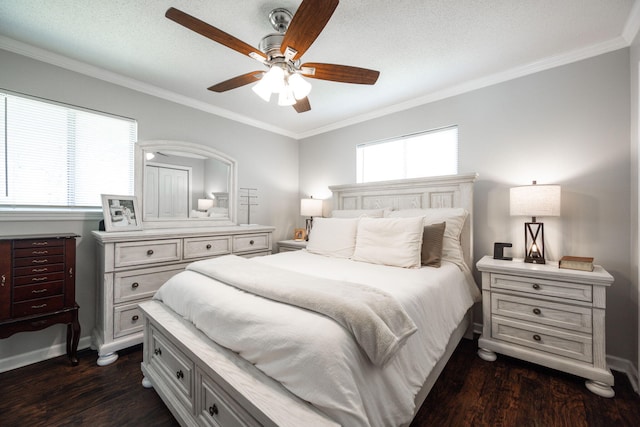 bedroom with a ceiling fan, crown molding, baseboards, and dark wood finished floors