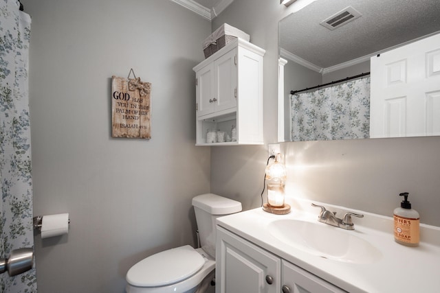 bathroom featuring crown molding, a textured ceiling, vanity, visible vents, and toilet