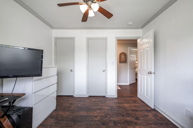 bedroom featuring crown molding, wood finished floors, and a textured ceiling