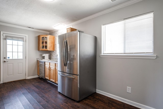 kitchen featuring ornamental molding, dark wood finished floors, glass insert cabinets, and stainless steel appliances