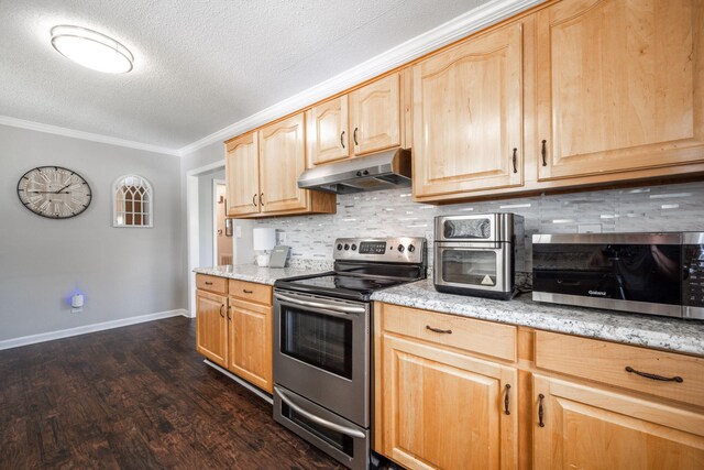 kitchen featuring a textured ceiling, light brown cabinetry, ornamental molding, under cabinet range hood, and stainless steel appliances