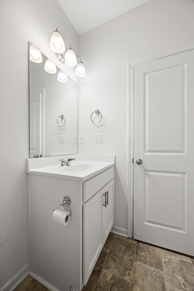 127 Huntley Meadows Dr, Rossville, GA 30741 - bathroom featuring stone finish flooring, vanity, and baseboards