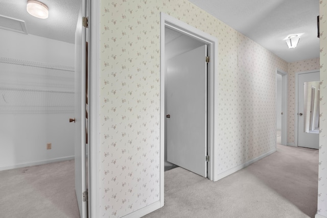 401 Laymons Rd, Hixson, TN 37343 - hallway featuring wallpapered walls, light colored carpet, and a textured ceiling