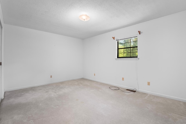 401 Laymons Rd, Hixson, TN 37343 - spare room featuring carpet flooring, a textured ceiling, and baseboards