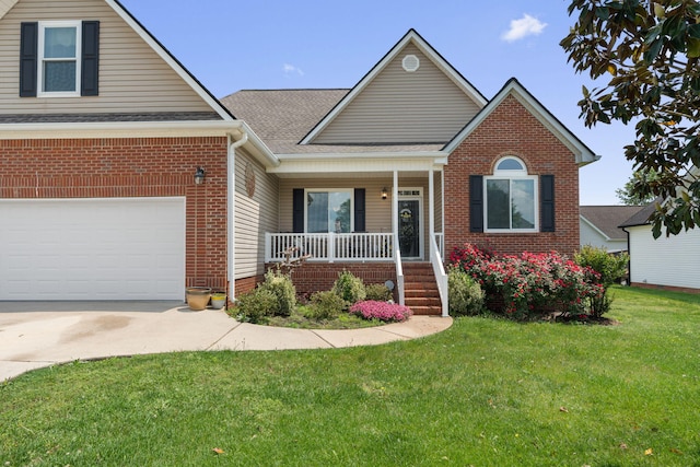 view of front of property with roof with shingles, a front lawn, brick siding, a porch, and concrete driveway