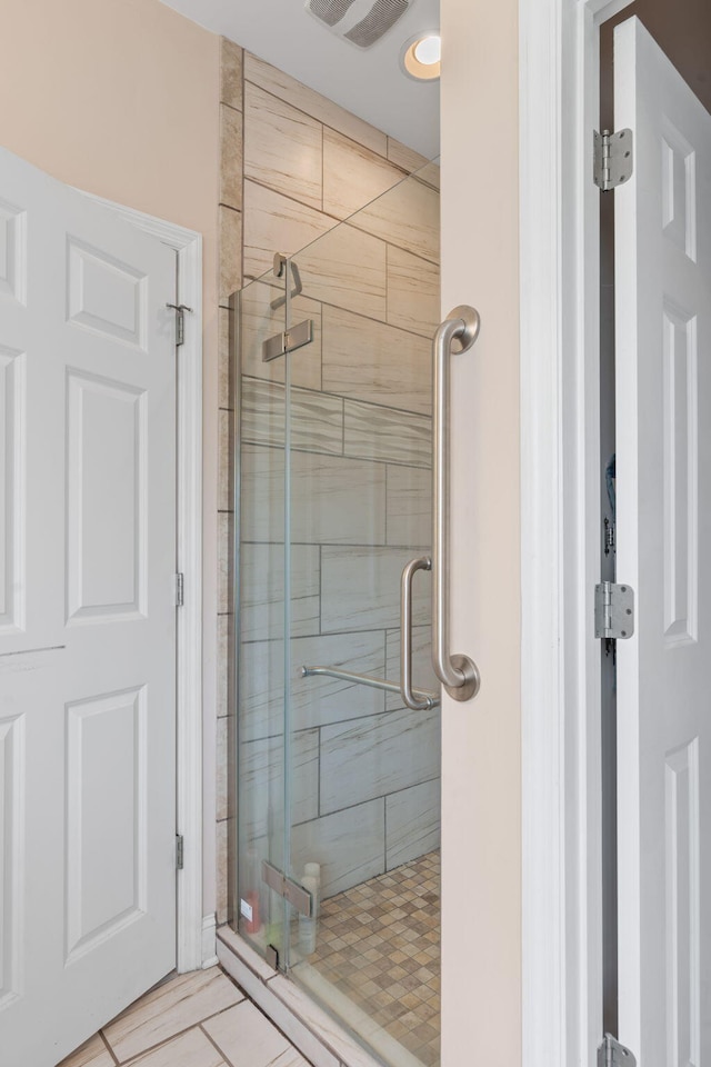 full bath featuring a stall shower and visible vents