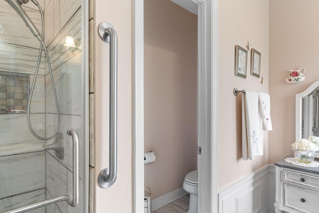 full bathroom featuring toilet and walk in shower