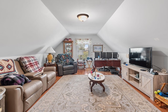 living area featuring wood finished floors and vaulted ceiling