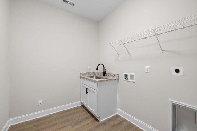 1555 Whisper Winds Ln Unit 44, Ooltewah, TN 37363 - laundry area featuring hookup for an electric dryer, hookup for a washing machine, and light wood-style floors