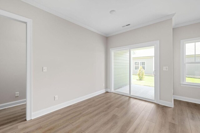 1555 Whisper Winds Ln Unit 44, Ooltewah, TN 37363 - unfurnished room with ornamental molding and light wood-style flooring