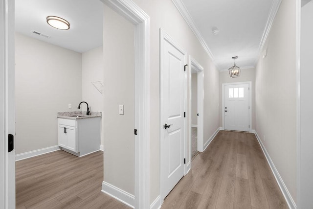 1555 Whisper Winds Ln Unit 44, Ooltewah, TN 37363 - hallway featuring ornamental molding and light wood-style floors