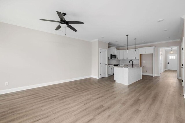 1555 Whisper Winds Ln Unit 44, Ooltewah, TN 37363 - unfurnished living room with crown molding, ceiling fan, light wood-style floors, and recessed lighting