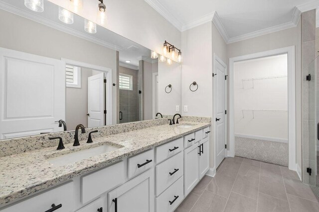 1555 Whisper Winds Ln Unit 44, Ooltewah, TN 37363 - bathroom featuring a stall shower, crown molding, double vanity, a walk in closet, and tile patterned floors