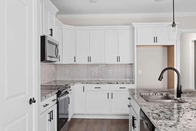 1555 Whisper Winds Ln Unit 44, Ooltewah, TN 37363 - kitchen featuring appliances with stainless steel finishes, white cabinetry, light stone countertops, tasteful backsplash, and ornamental molding