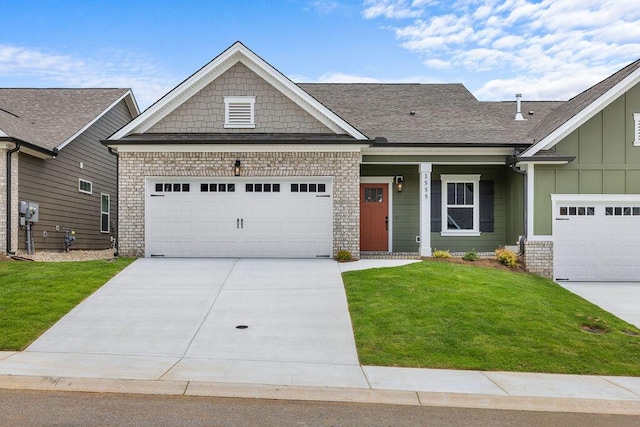 1555 Whisper Winds Ln Unit 44, Ooltewah, TN 37363 - view of front of home with board and batten siding, a front lawn, driveway, a garage, and a shingled roof