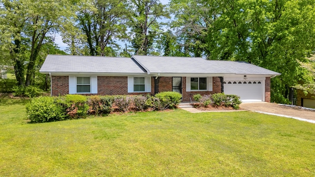 ranch-style house with a garage, brick siding, a front yard, and driveway