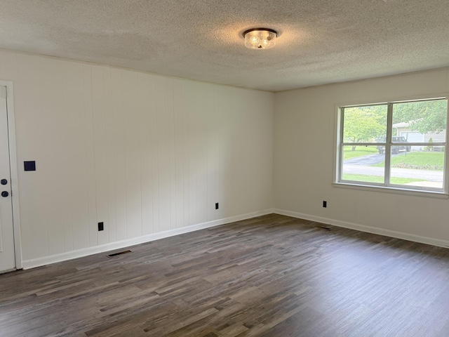 5410 Sunny Dell Ln, Chattanooga, TN 37412 - unfurnished room featuring dark wood-style floors, a textured ceiling, and baseboards