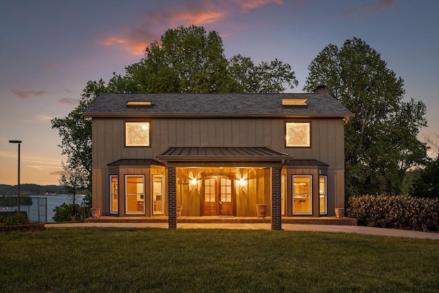 6500 Waconda Point Rd, Harrison, TN 37341 - back of property with a lawn, a standing seam roof, a shingled roof, and french doors