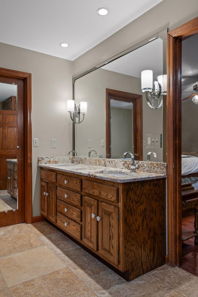 6500 Waconda Point Rd, Harrison, TN 37341 - bathroom featuring double vanity, stone finish flooring, baseboards, and a sink