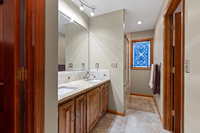 6500 Waconda Point Rd, Harrison, TN 37341 - bathroom with decorative backsplash, baseboards, a sink, and shower / bath combination with glass door