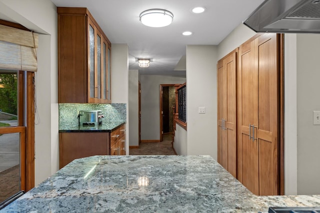 6500 Waconda Point Rd, Harrison, TN 37341 - kitchen featuring brown cabinets, tasteful backsplash, stone countertops, and glass insert cabinets