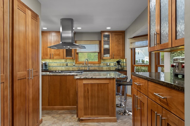 6500 Waconda Point Rd, Harrison, TN 37341 - kitchen featuring backsplash, brown cabinetry, island exhaust hood, and dark stone countertops
