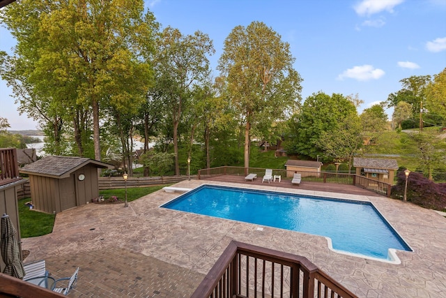 6500 Waconda Point Rd, Harrison, TN 37341 - view of swimming pool featuring fence, a storage unit, an outdoor structure, and a patio