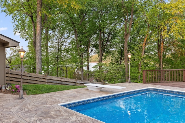 6500 Waconda Point Rd, Harrison, TN 37341 - outdoor pool featuring fence, a wooden deck, a diving board, and a patio