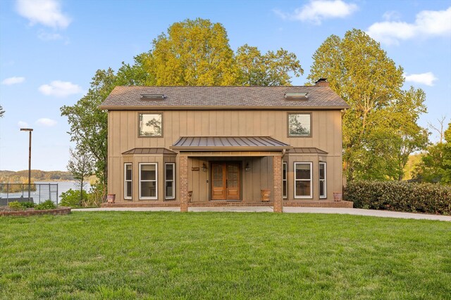 6500 Waconda Point Rd, Harrison, TN 37341 - rear view of property featuring a chimney, a yard, board and batten siding, a standing seam roof, and french doors
