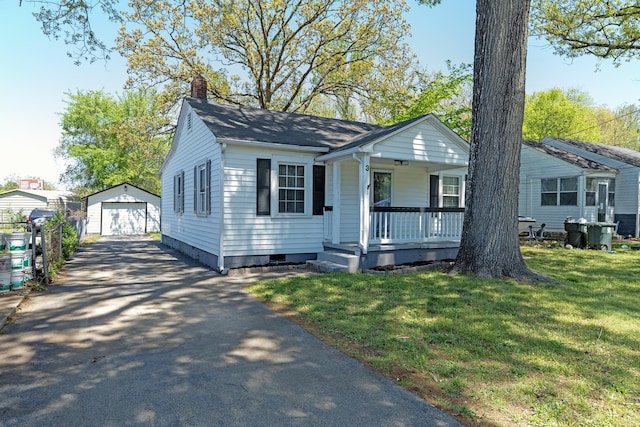 3 Whirlaway Dr, Chattanooga, TN 37421 - bungalow-style home featuring an outbuilding, aphalt driveway, a porch, a front yard, and a garage