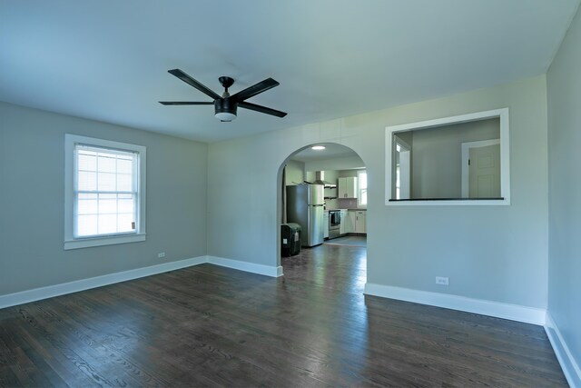 3 Whirlaway Dr, Chattanooga, TN 37421 - unfurnished room featuring arched walkways, ceiling fan, baseboards, and dark wood finished floors