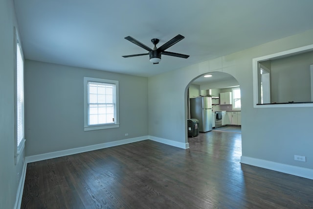 3 Whirlaway Dr, Chattanooga, TN 37421 - unfurnished room with baseboards, a ceiling fan, arched walkways, and dark wood-style floors