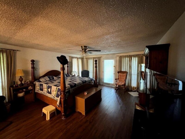bedroom featuring a textured ceiling, dark wood-style flooring, a ceiling fan, and access to exterior