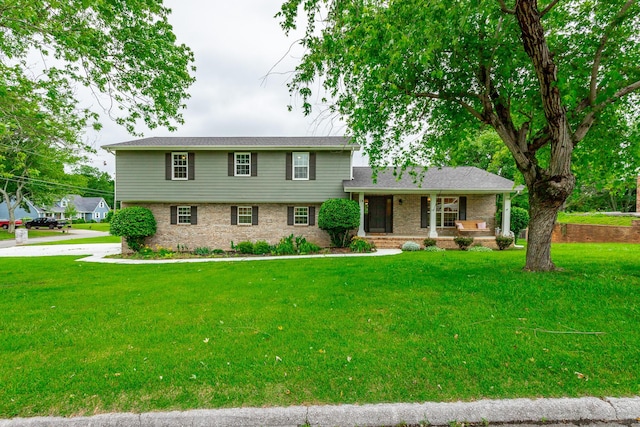 14 Hillcrest Ct, Ringgold, GA 30736 - tri-level home featuring a porch, a front yard, and brick siding