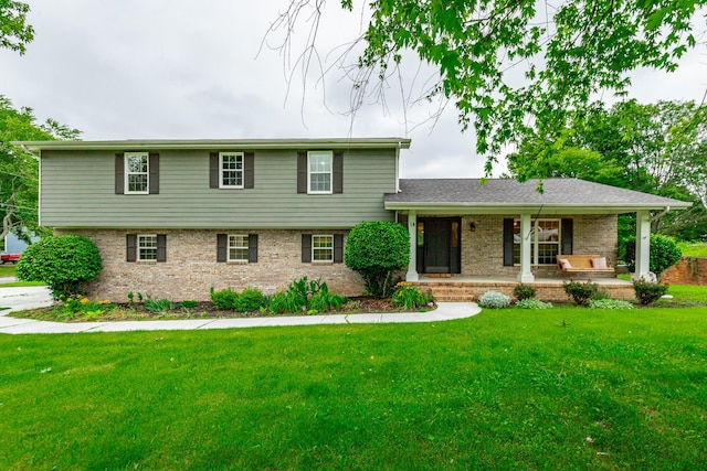 14 Hillcrest Ct, Ringgold, GA 30736 - tri-level home featuring brick siding, a front yard, and a porch