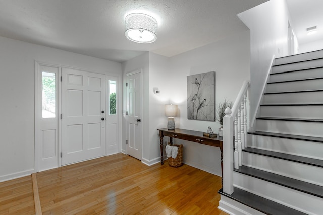 14 Hillcrest Ct, Ringgold, GA 30736 - foyer featuring stairway, wood finished floors, and baseboards